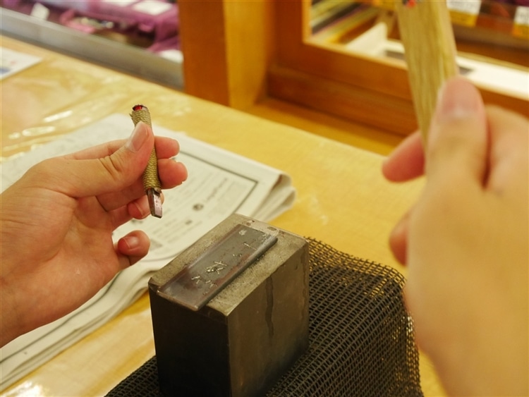 Knife-sharpening at centuries-old knife maker